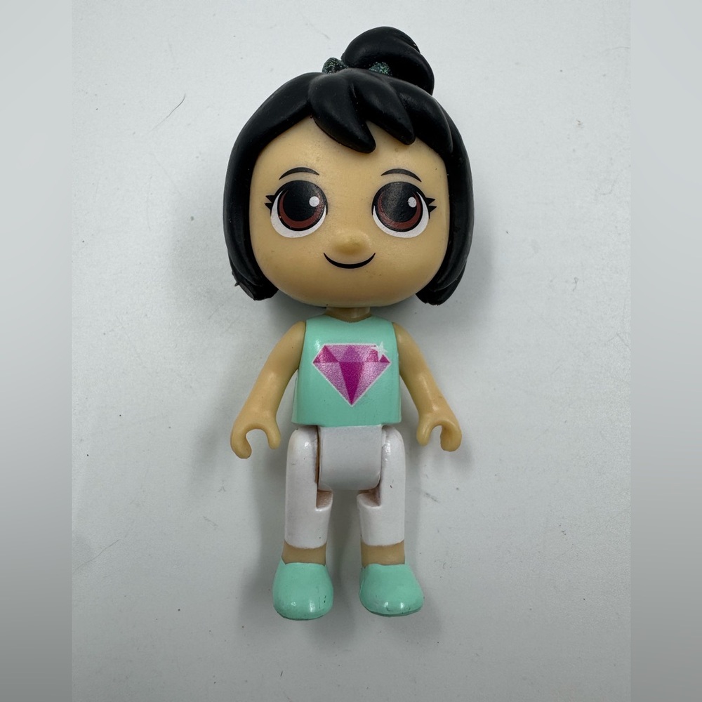 Remka mini figures girl pink Diamond on a green shirt. 3”